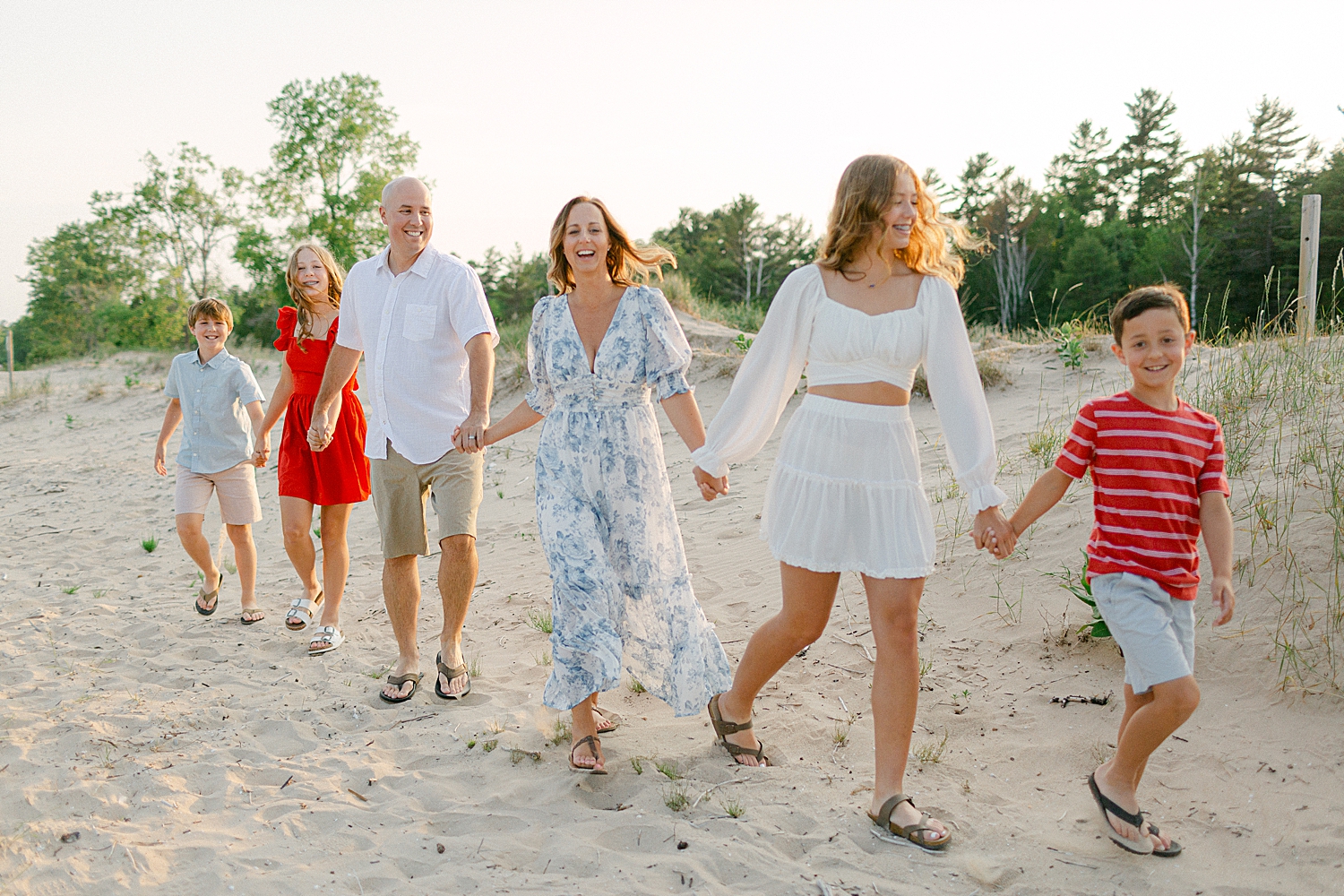family walking on the beach at a Sturgeon Bay Canal Light Family Session