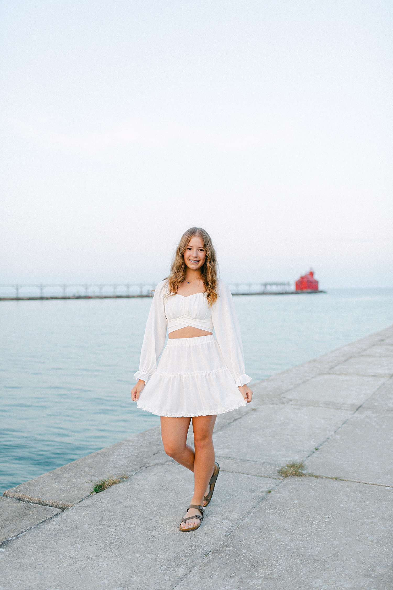 Oldest daughter photo on the beach at their Sturgeon Bay Canal Light Family Session