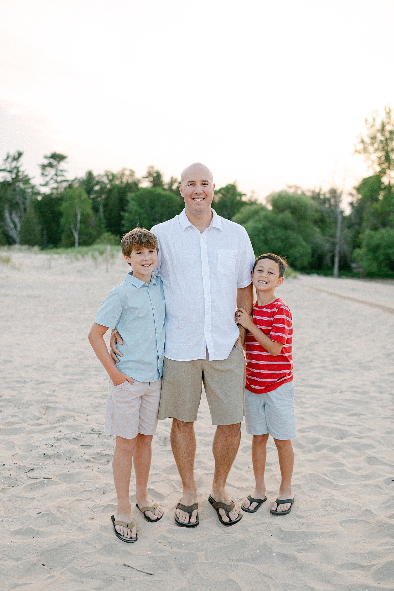 Father & Son photo on the beach at their Sturgeon Bay Canal Light Family Session