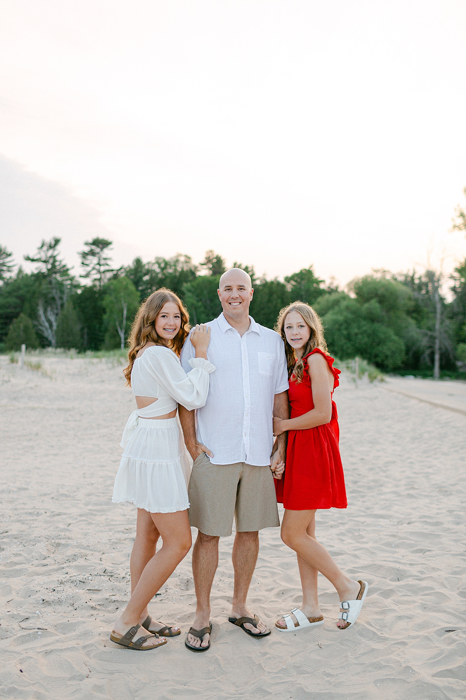 Father & Daughter photo on the beach at their Sturgeon Bay Canal Light Family Session