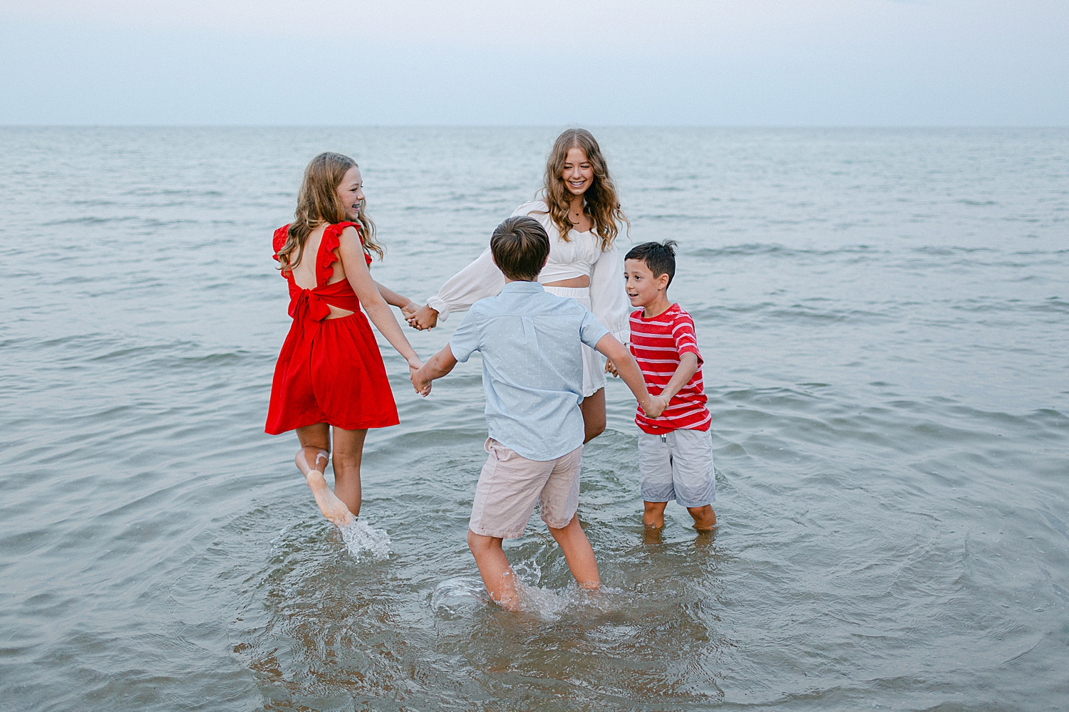 Kids playing in the water at the Sturgeon Bay Canal Nature Preserve Beach at a Family Photo Locations in Door County