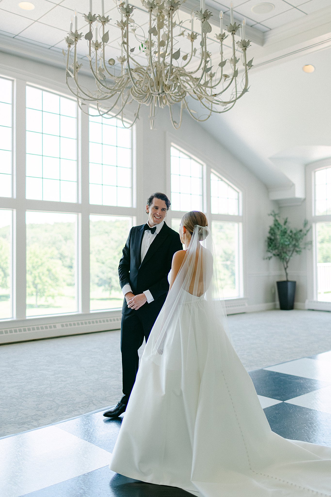 Emily & Clark on their wedding day at Oneida Golf & Country Club and Why we think a first look is a must-have on your wedding day.