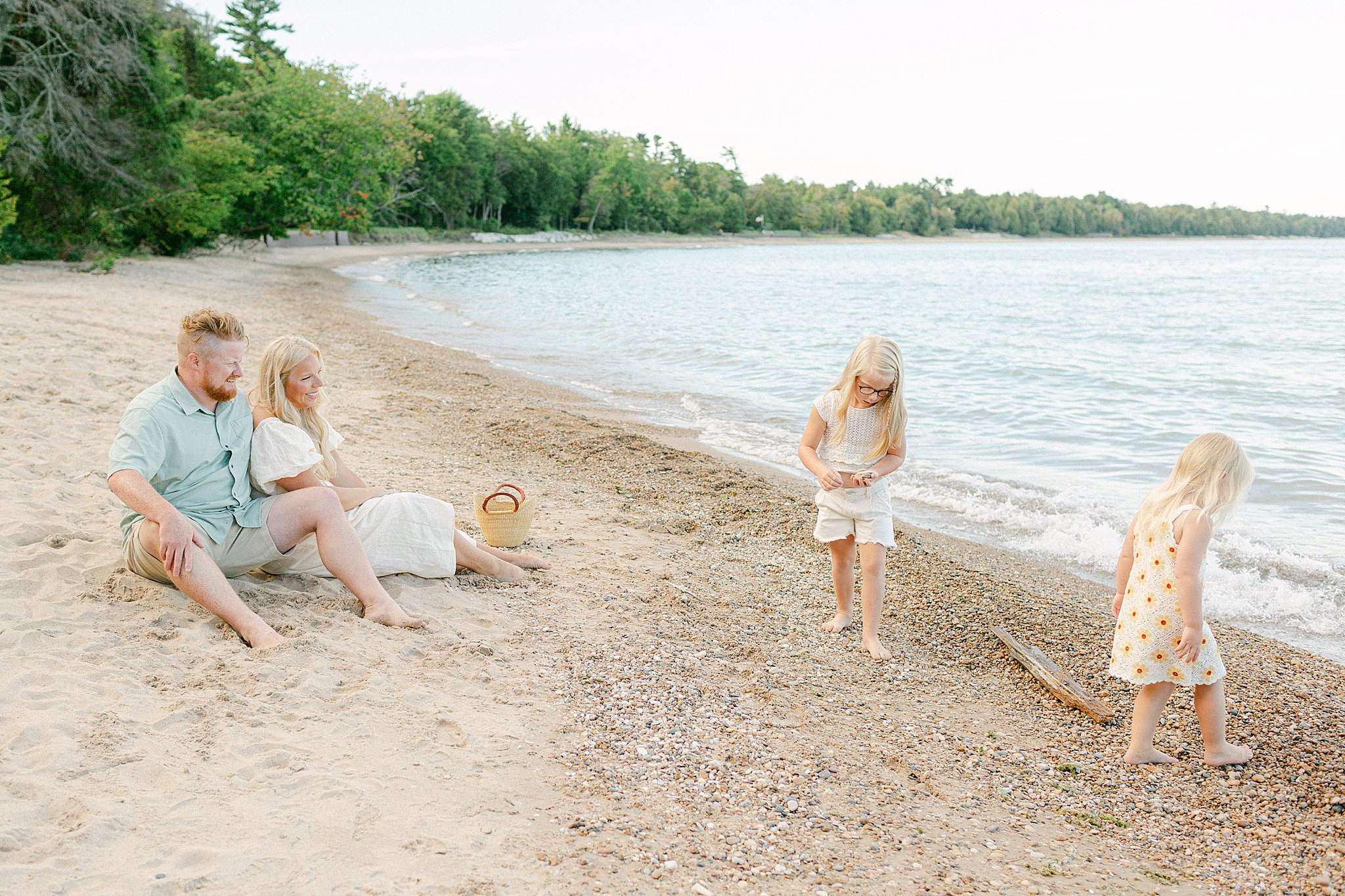 Family enjoying the beach at their family photos at Portrage Park. Family Photo Locations in Door County