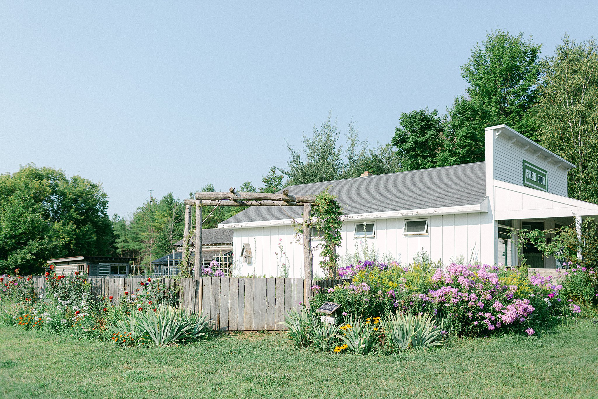 the general store and flower garden at the Honey Harvest at Crossroads